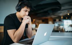 man looking at laptop screen