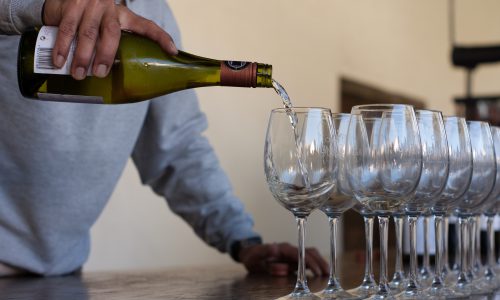 man pouring wine