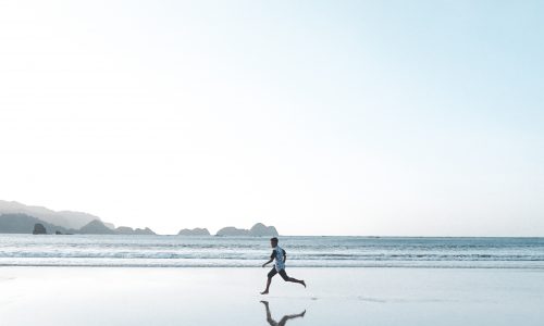 man running on beach