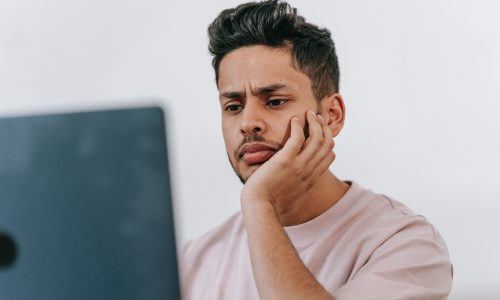 man looking at laptop